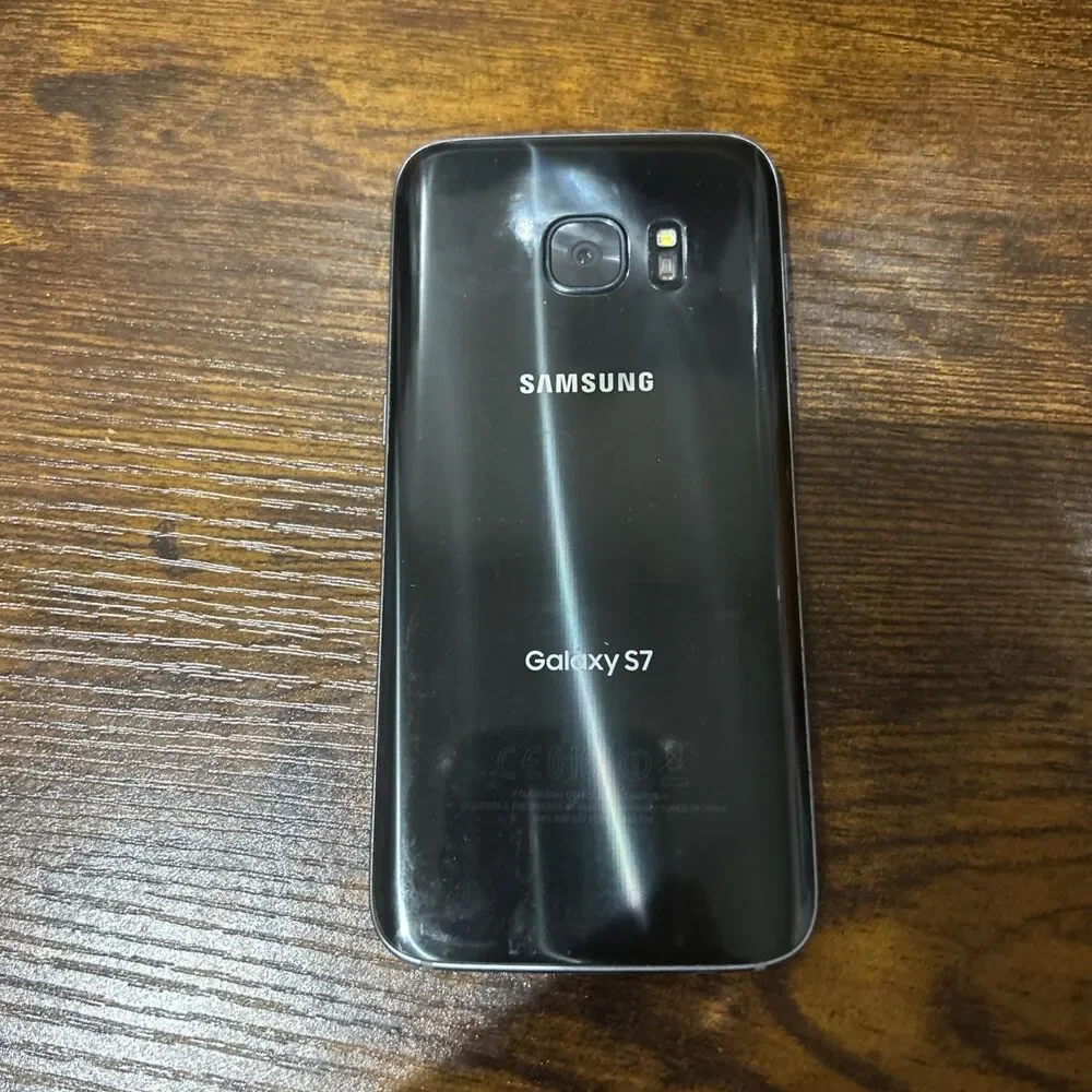 Samsung Galaxy S7 SM-G930V 32GB Onyx Black look at photos for condition